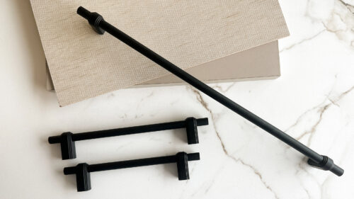 modern stainless steel kitchen handles on white cabinets