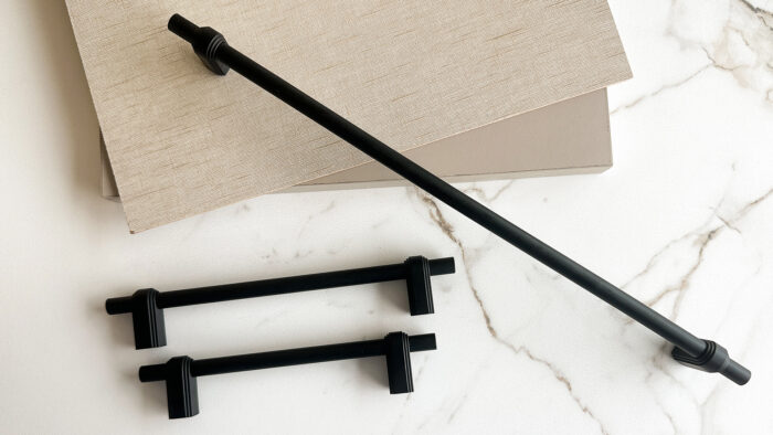 modern stainless steel kitchen handles on white cabinets